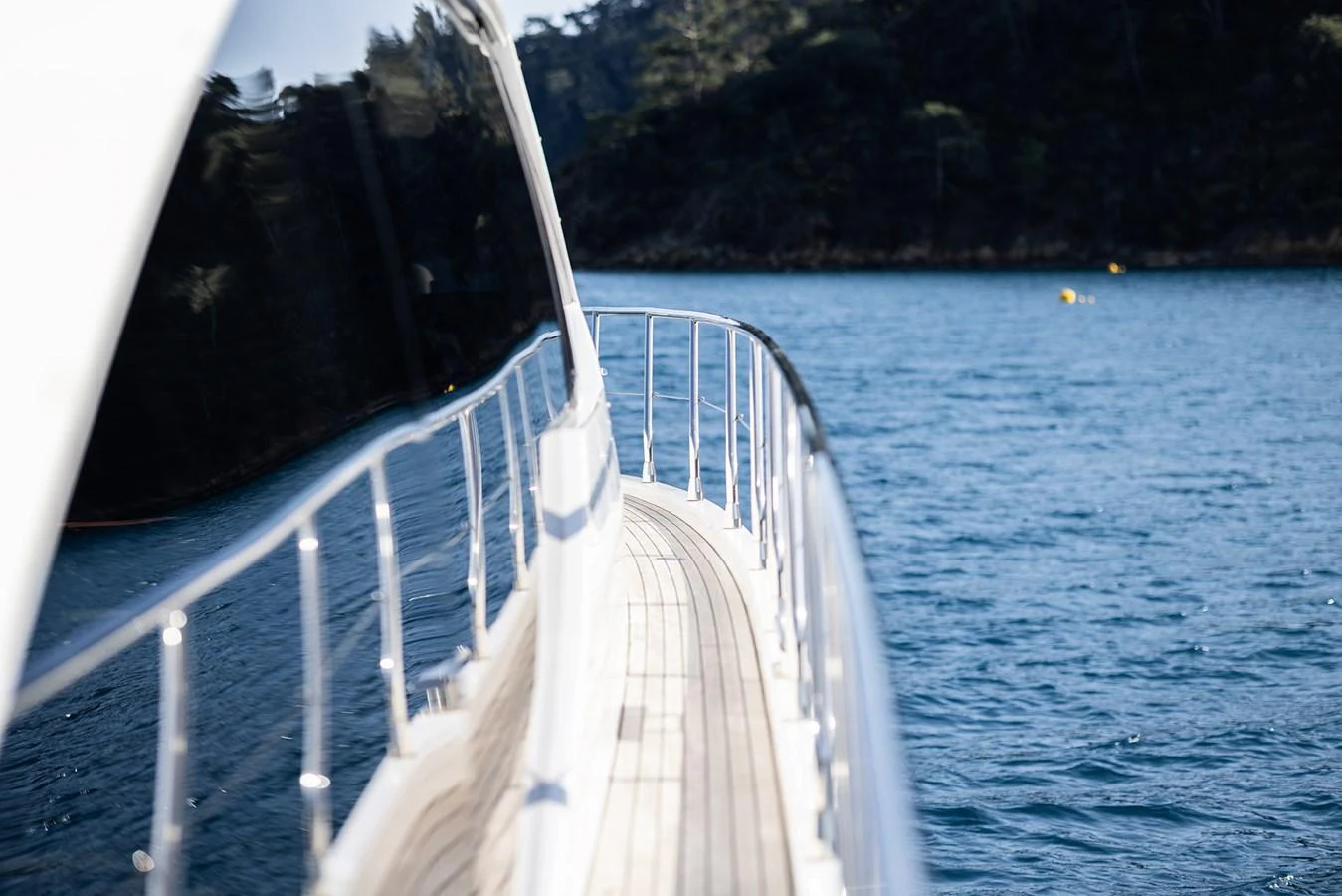 A sleek yacht deck with polished railings and a stunning water view. aboard AZ FLY 66 Yacht for Sale