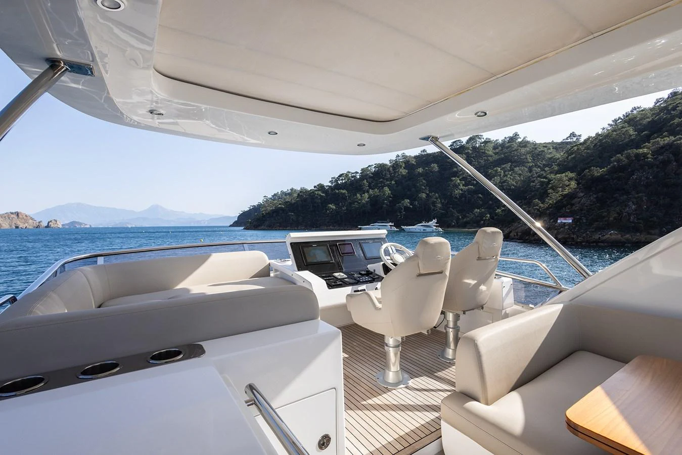 The helm area offers a spacious and modern command center with comfortable seating and panoramic views. aboard AZ FLY 66 Yacht for Sale