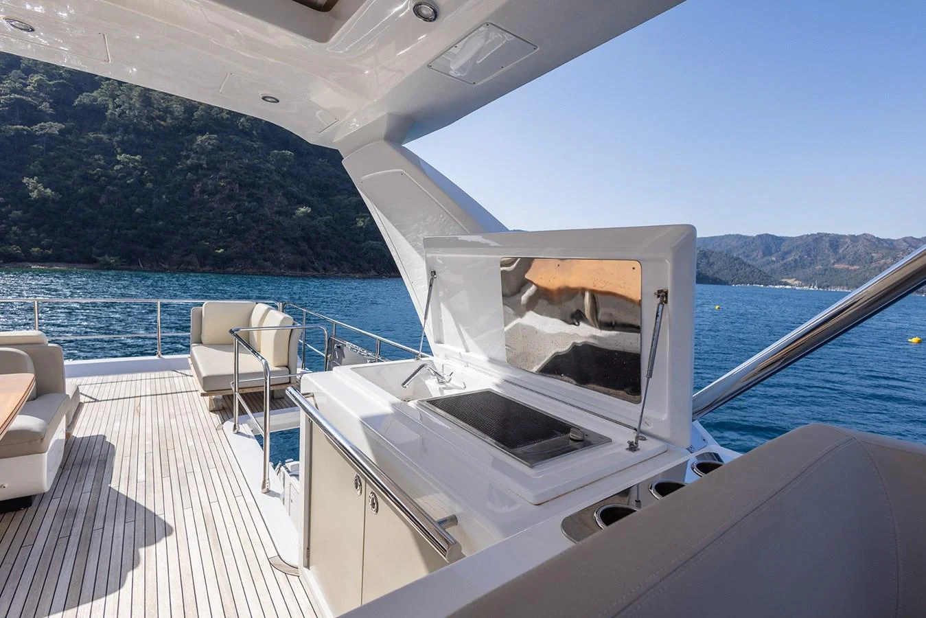 The flybridge features a sleek outdoor kitchen with stunning sea views. aboard AZ FLY 66 Yacht for Sale