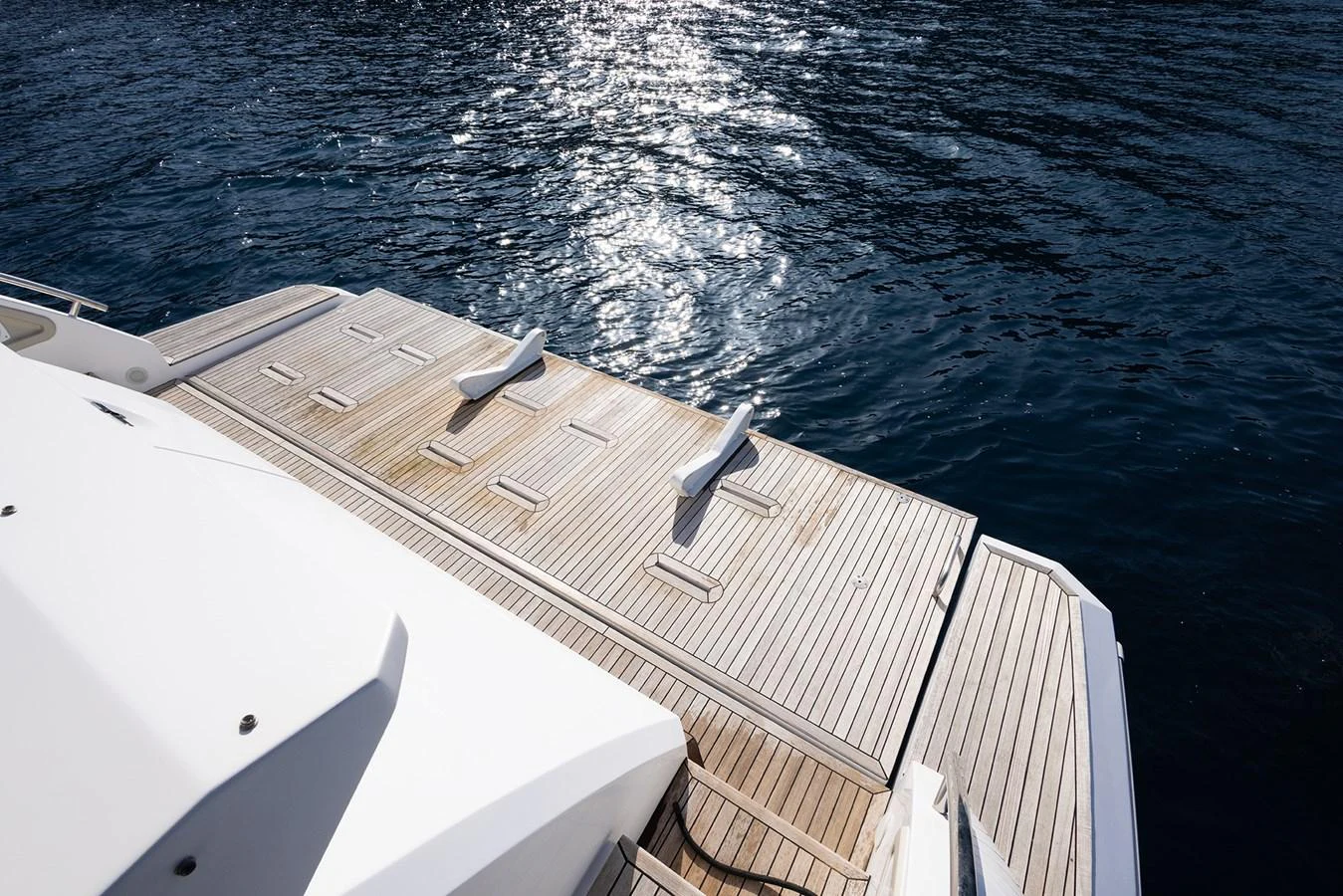 The image showcases the yacht's swim platform with a view of the surrounding water. aboard AZ FLY 66 Yacht for Sale