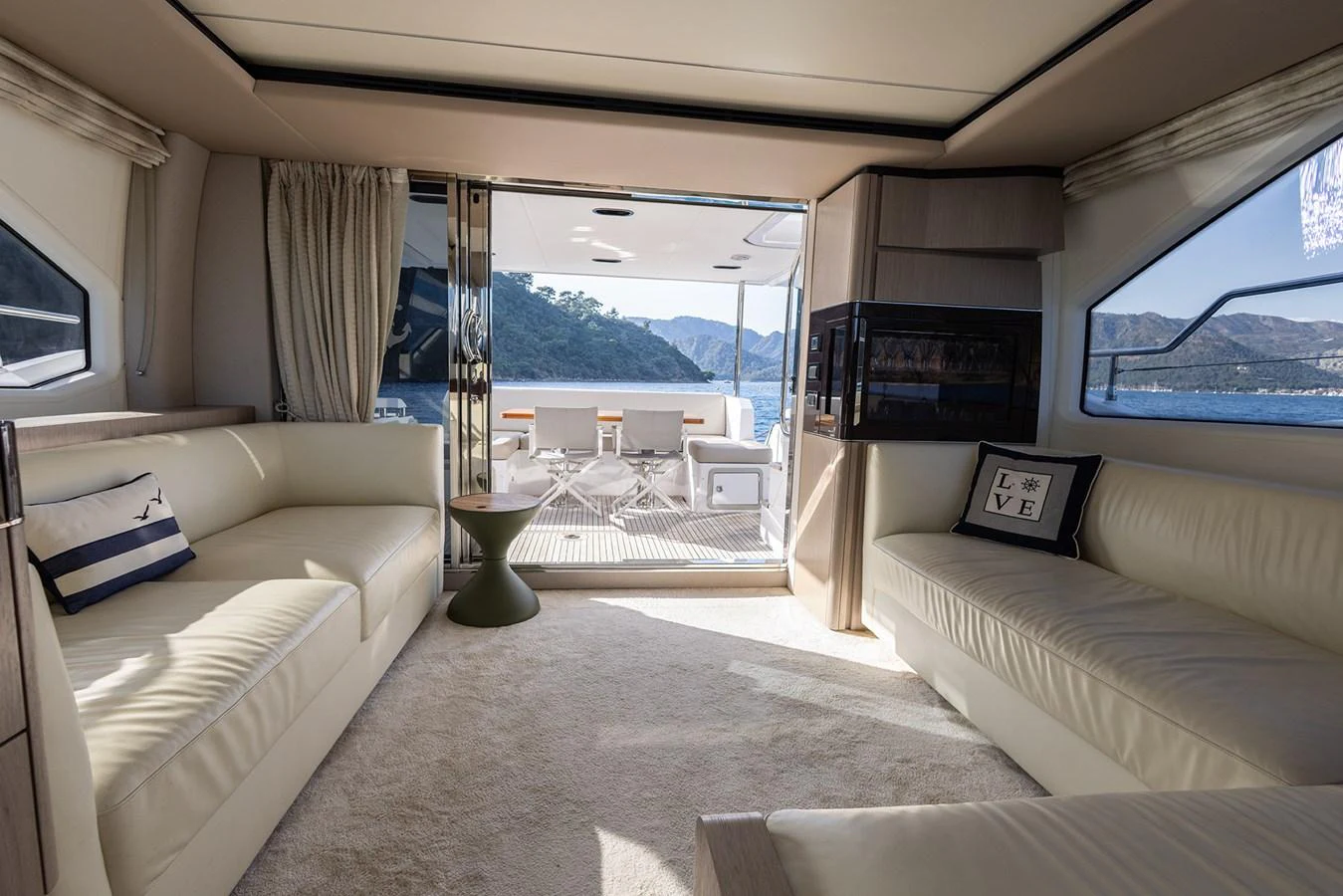 The salon offers a luxurious and comfortable space with ample seating and a view of the aft deck. aboard AZ FLY 66 Yacht for Sale