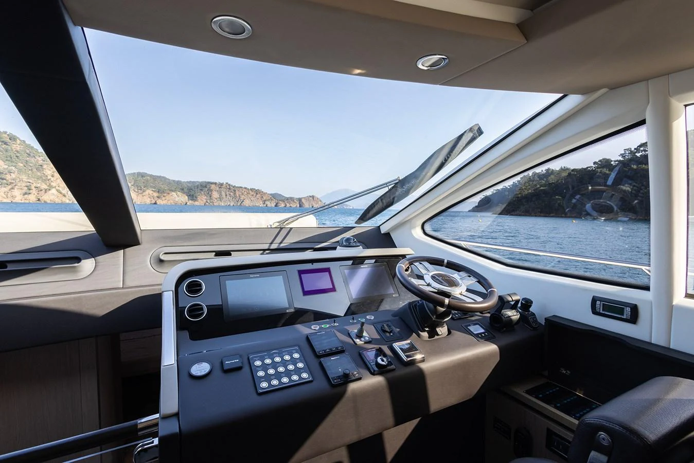 The helm station offers a modern and sleek design with advanced navigation equipment and panoramic views. aboard AZ FLY 66 Yacht for Sale