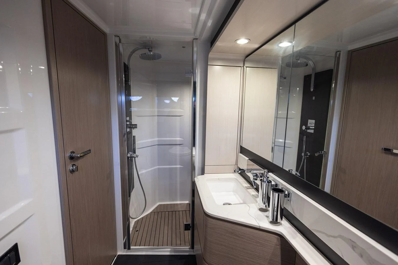 The yacht's bathroom features a sleek design with modern fixtures and ample lighting. aboard AZ FLY 66 Yacht for Sale