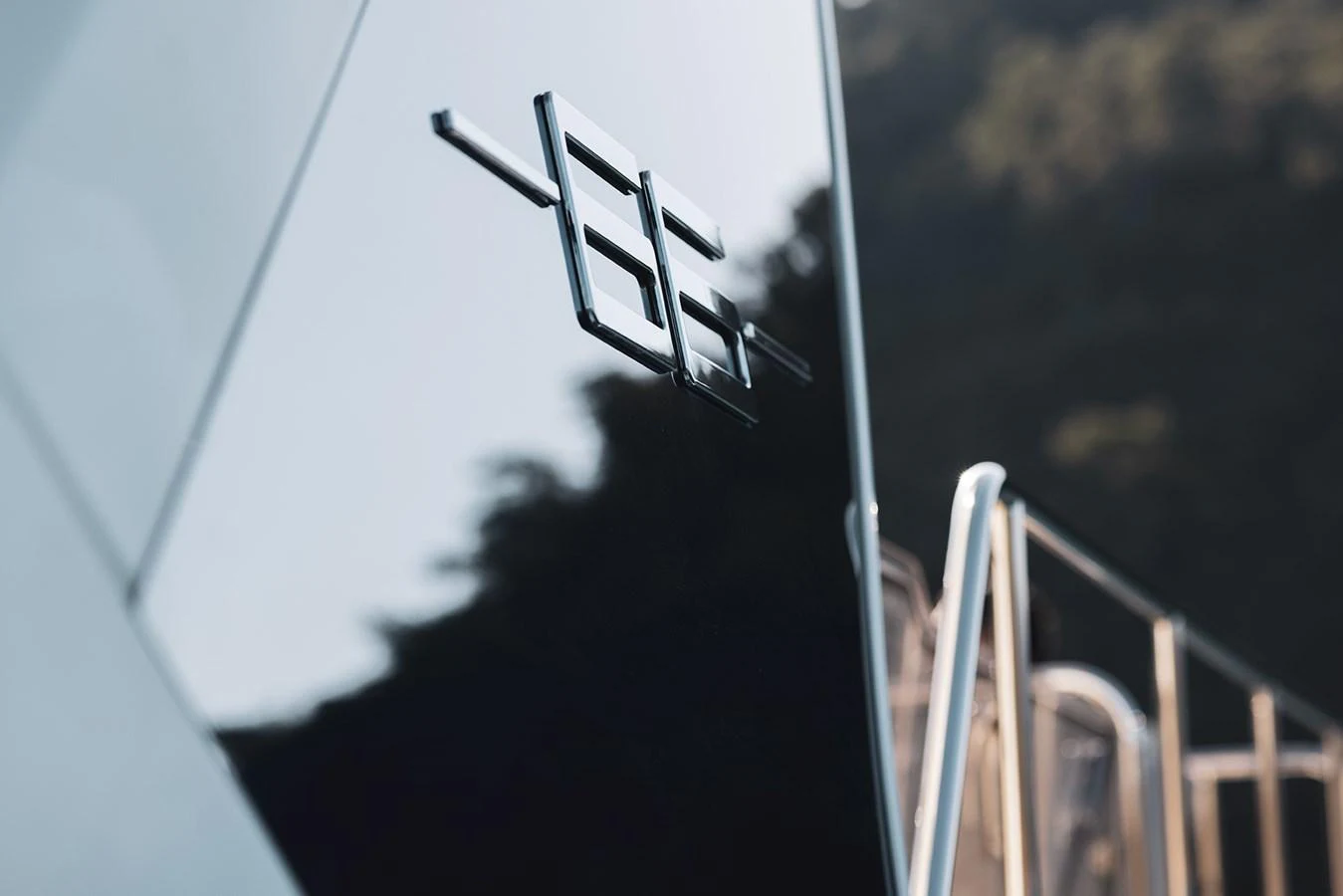 A close-up of the yacht's sleek exterior showcasing a stylish logo. aboard AZ FLY 66 Yacht for Sale