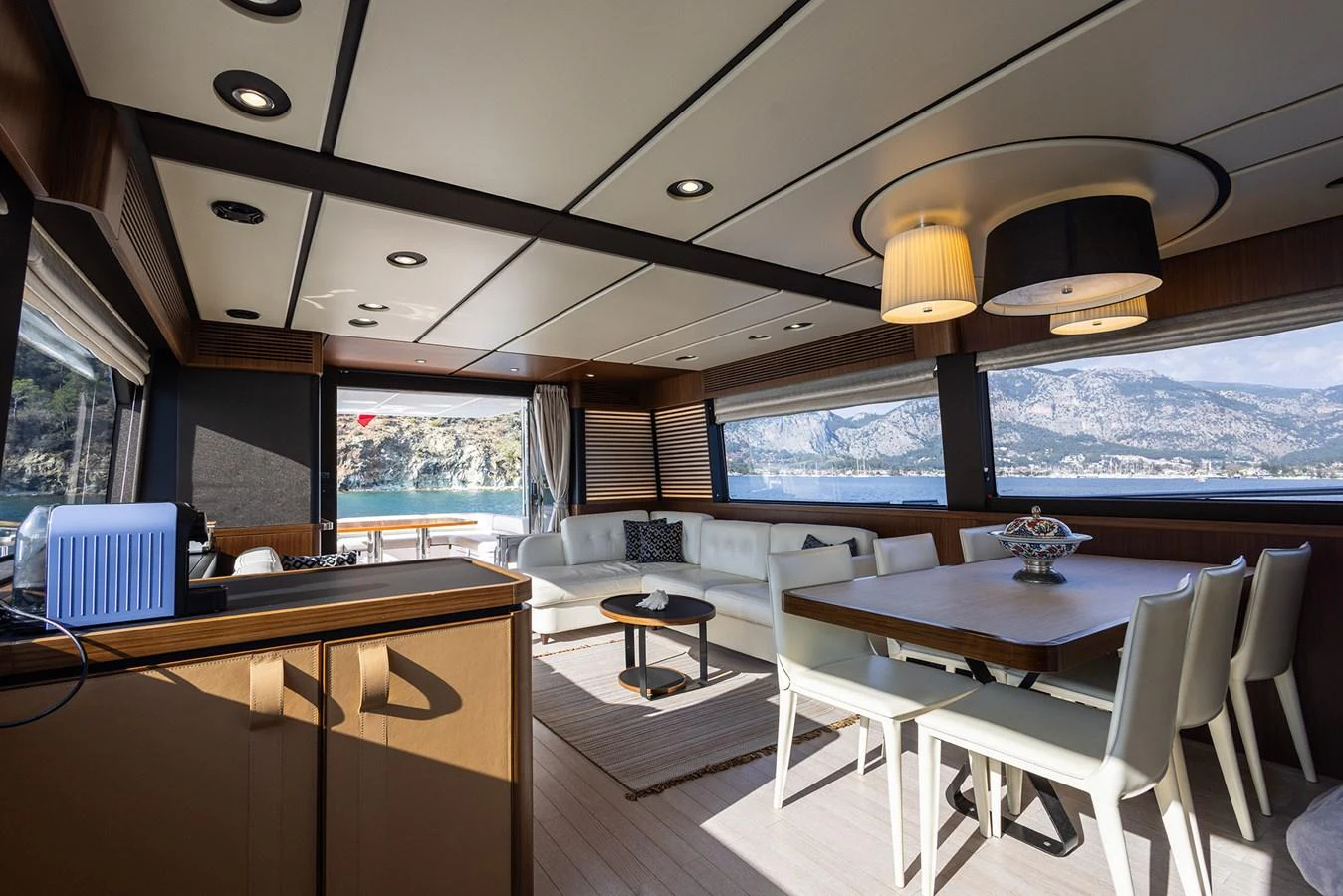 The yacht's salon offers a spacious and elegantly designed area with ample natural light and stunning views. aboard AZ MAGELLANO 66 Yacht for Sale