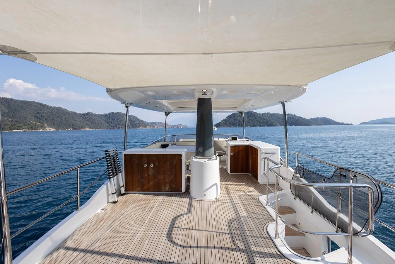 The flybridge offers a spacious and inviting area for relaxation and enjoying scenic views. aboard AZ MAGELLANO 66 Yacht for Sale