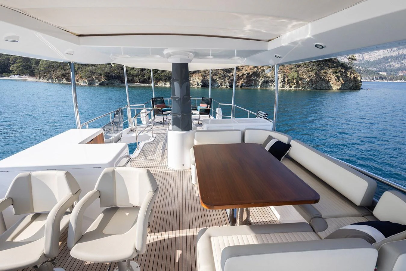 The aft deck offers a spacious and inviting area for alfresco dining and relaxation with stunning views of the surrounding waters. aboard AZ MAGELLANO 66 Yacht for Sale