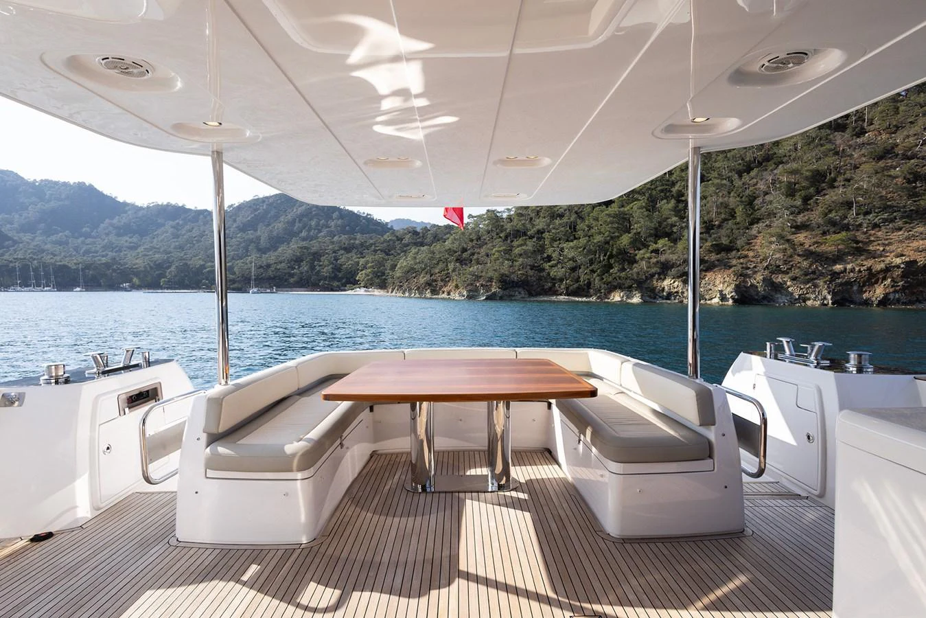 The aft deck offers a spacious and inviting area for alfresco dining with stunning views of the surrounding waters. aboard AZ MAGELLANO 66 Yacht for Sale