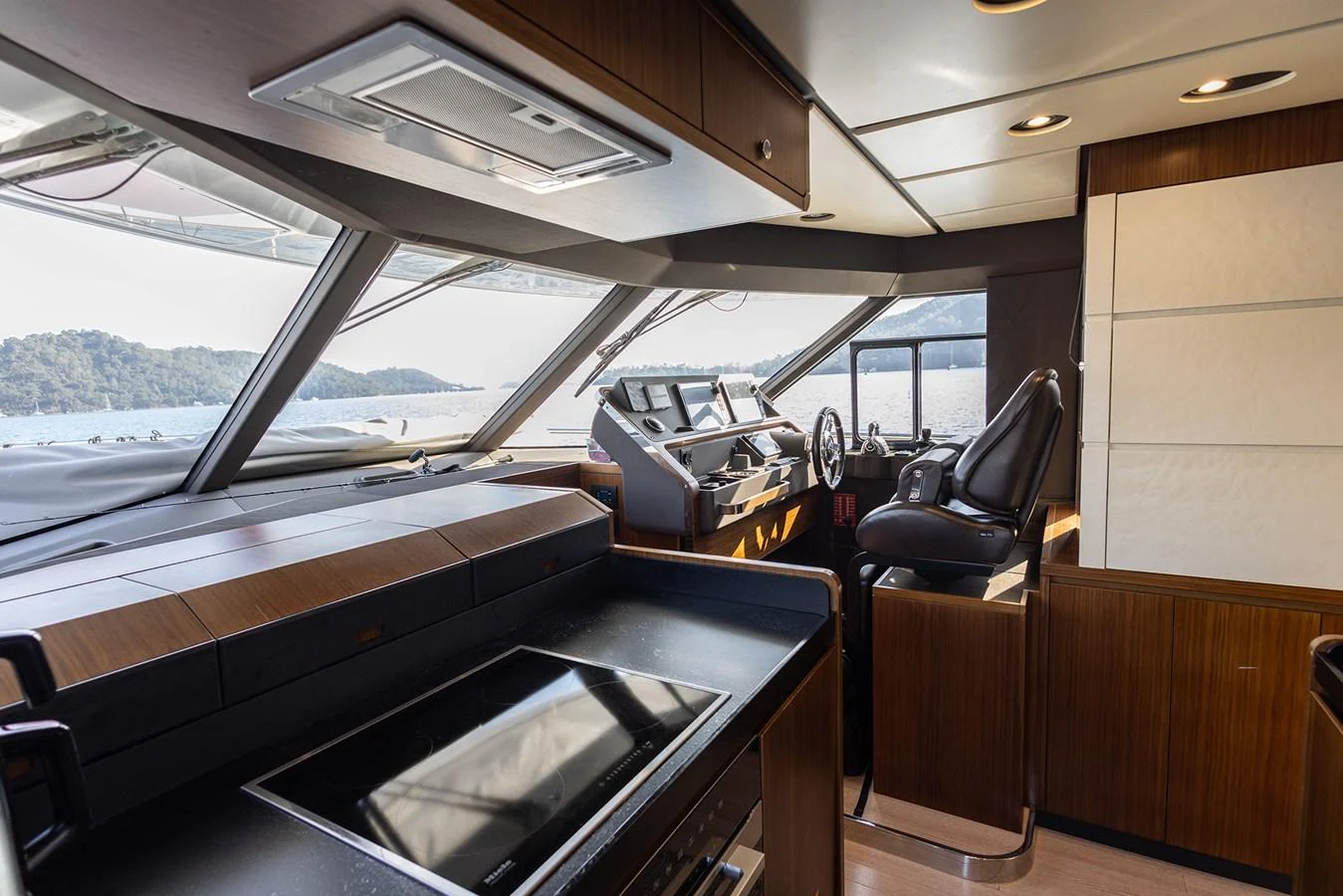 The helm station offers a commanding view with modern navigation equipment and luxurious seating. aboard AZ MAGELLANO 66 Yacht for Sale