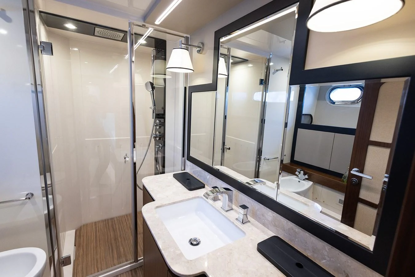The yacht's bathroom features a modern design with a spacious shower and elegant fixtures. aboard AZ MAGELLANO 66 Yacht for Sale