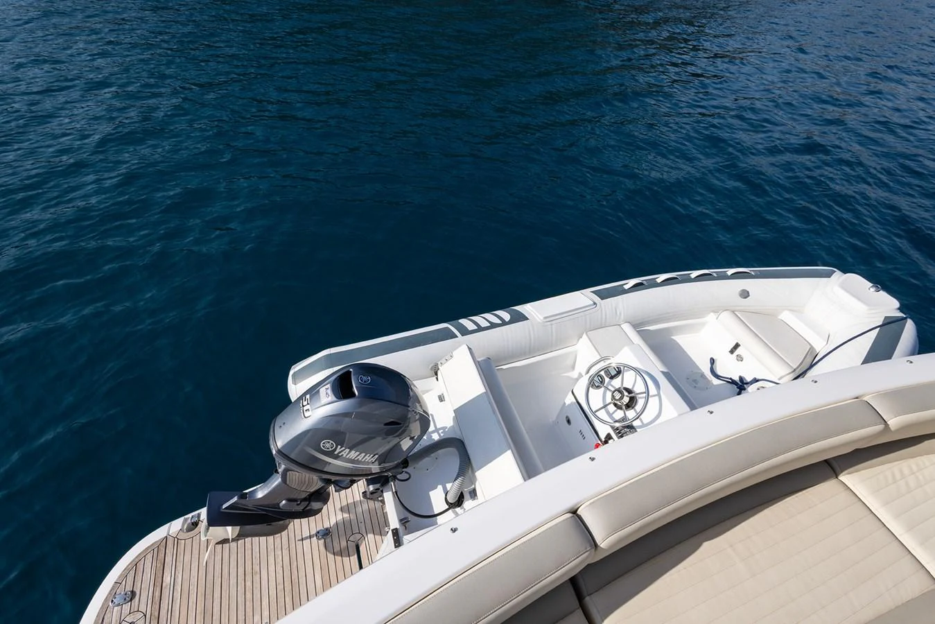 The image showcases the stern of a yacht with a Yamaha outboard motor and a spacious seating area. aboard AZ MAGELLANO 66 Yacht for Sale