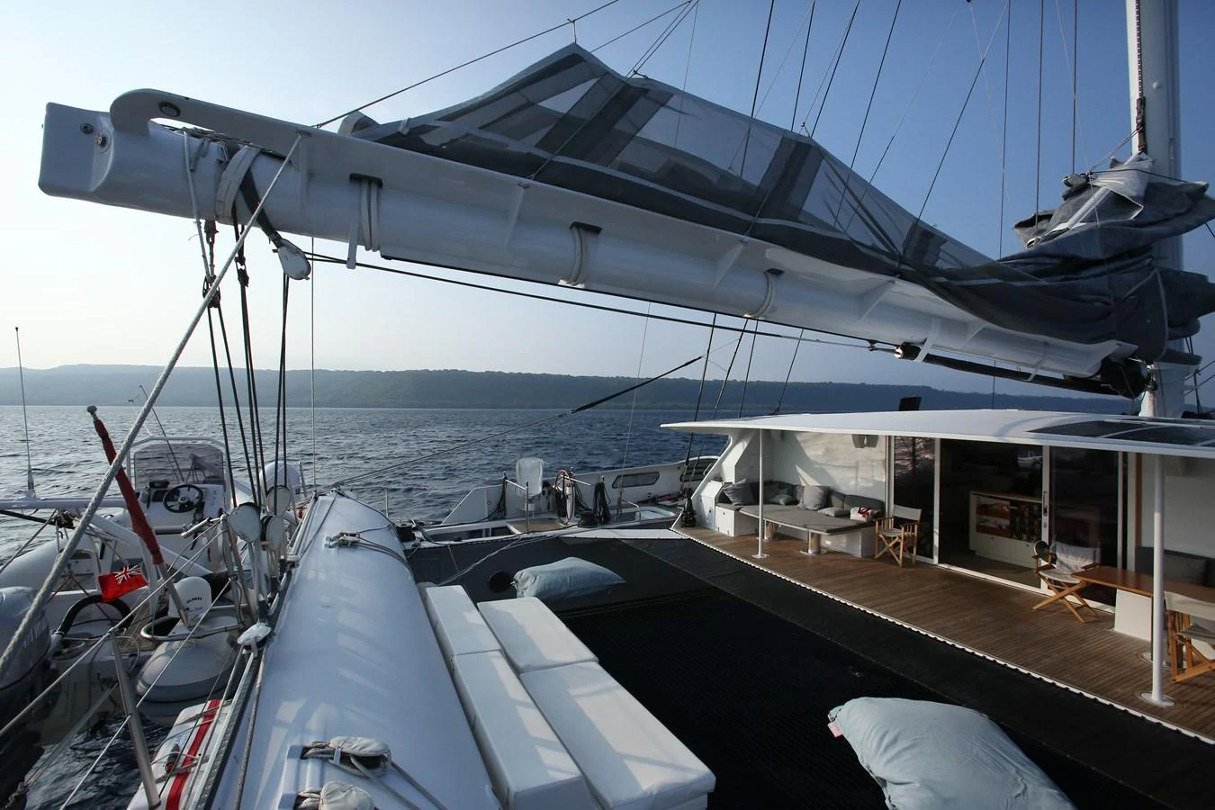 The aft deck of the yacht features a spacious lounging area with a view of the open sea. aboard VITALIA II Yacht for Sale