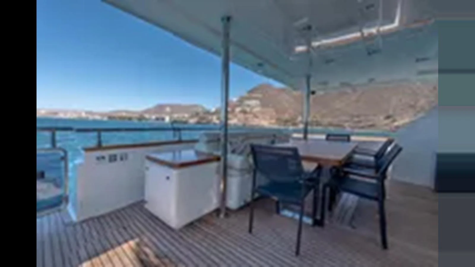 The aft deck offers a comfortable outdoor dining area with stunning views of the surrounding waters. aboard 2012 FERRETTI YACHTS CUSTOM LINE 100 Yacht for Sale