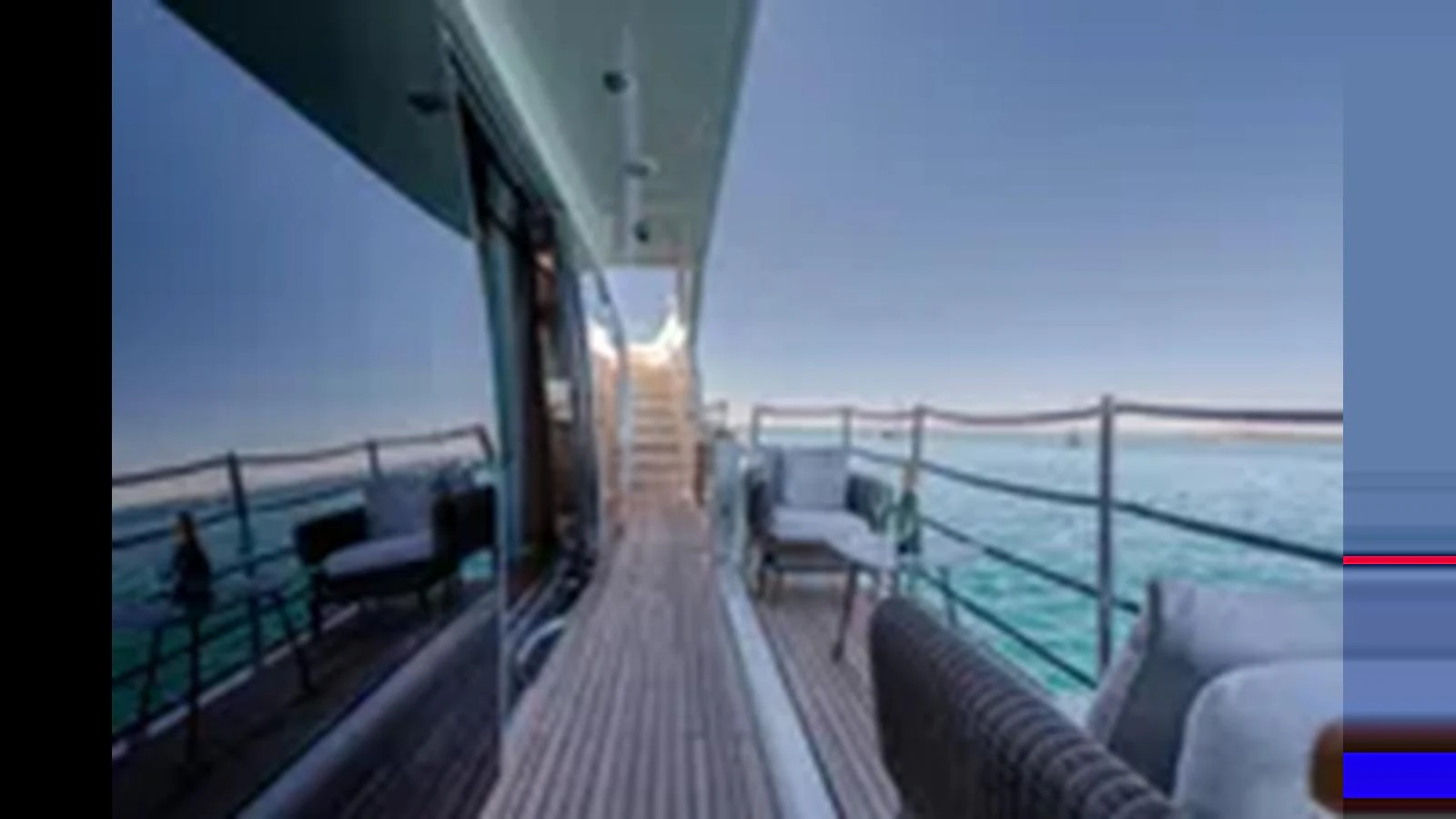 The side deck offers a serene walkway with comfortable seating and stunning ocean views. aboard 2012 FERRETTI YACHTS CUSTOM LINE 100 Yacht for Sale
