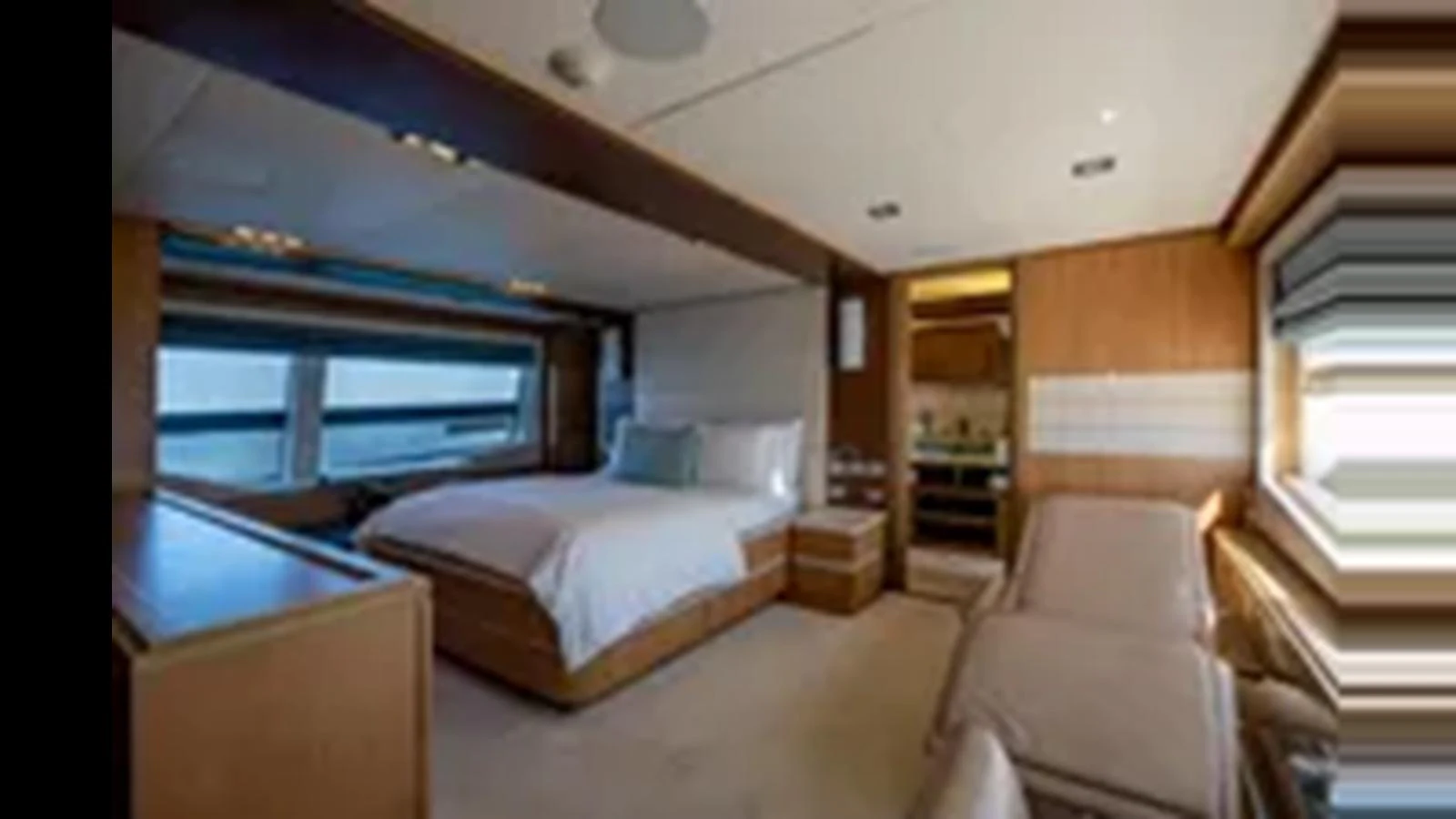 The master stateroom features a luxurious bed, ample natural light, and elegant wood finishes. aboard 2012 FERRETTI YACHTS CUSTOM LINE 100 Yacht for Sale
