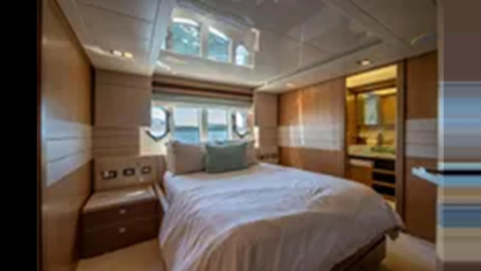 The stateroom features a comfortable bed with ample natural light from the windows. aboard 2012 FERRETTI YACHTS CUSTOM LINE 100 Yacht for Sale