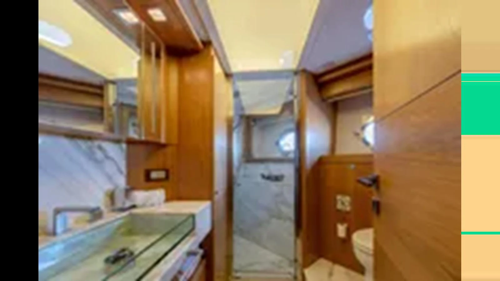 The yacht's bathroom features a modern design with wooden accents and a glass shower enclosure. aboard 2012 FERRETTI YACHTS CUSTOM LINE 100 Yacht for Sale