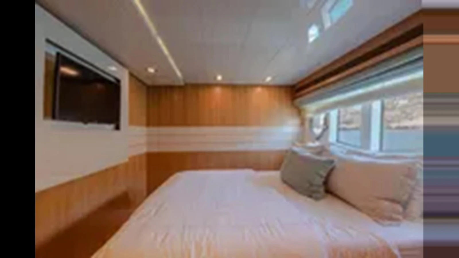 The stateroom features a comfortable bed with a modern design and ample natural light. aboard 2012 FERRETTI YACHTS CUSTOM LINE 100 Yacht for Sale