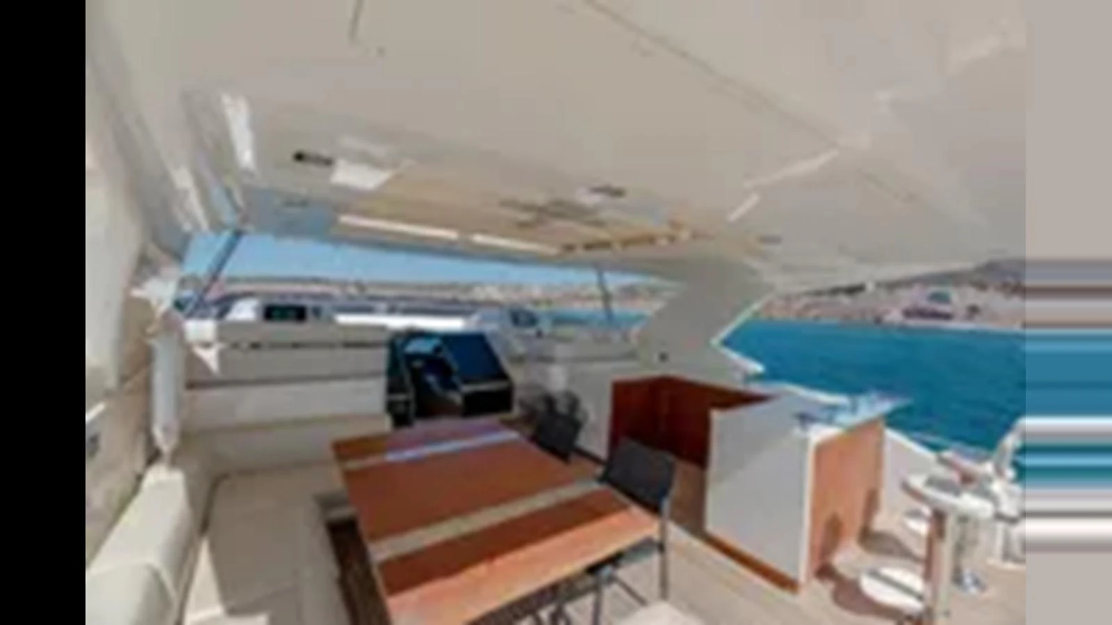 The flybridge offers a spacious and open area with comfortable seating and a dining table, perfect for enjoying the sea views. aboard 2012 FERRETTI YACHTS CUSTOM LINE 100 Yacht for Sale