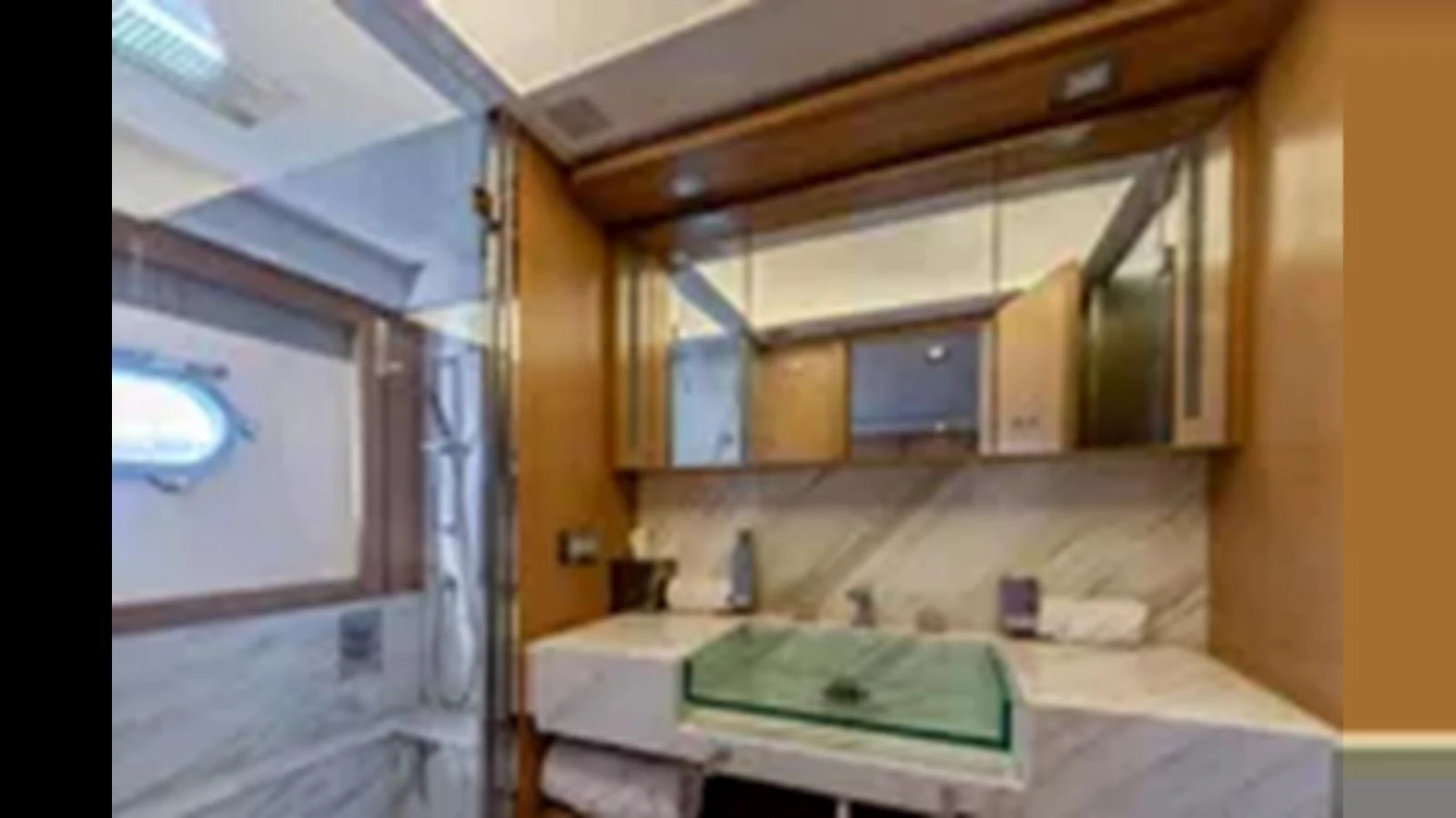 The yacht's bathroom features a modern design with a glass sink and marble accents. aboard 2012 FERRETTI YACHTS CUSTOM LINE 100 Yacht for Sale