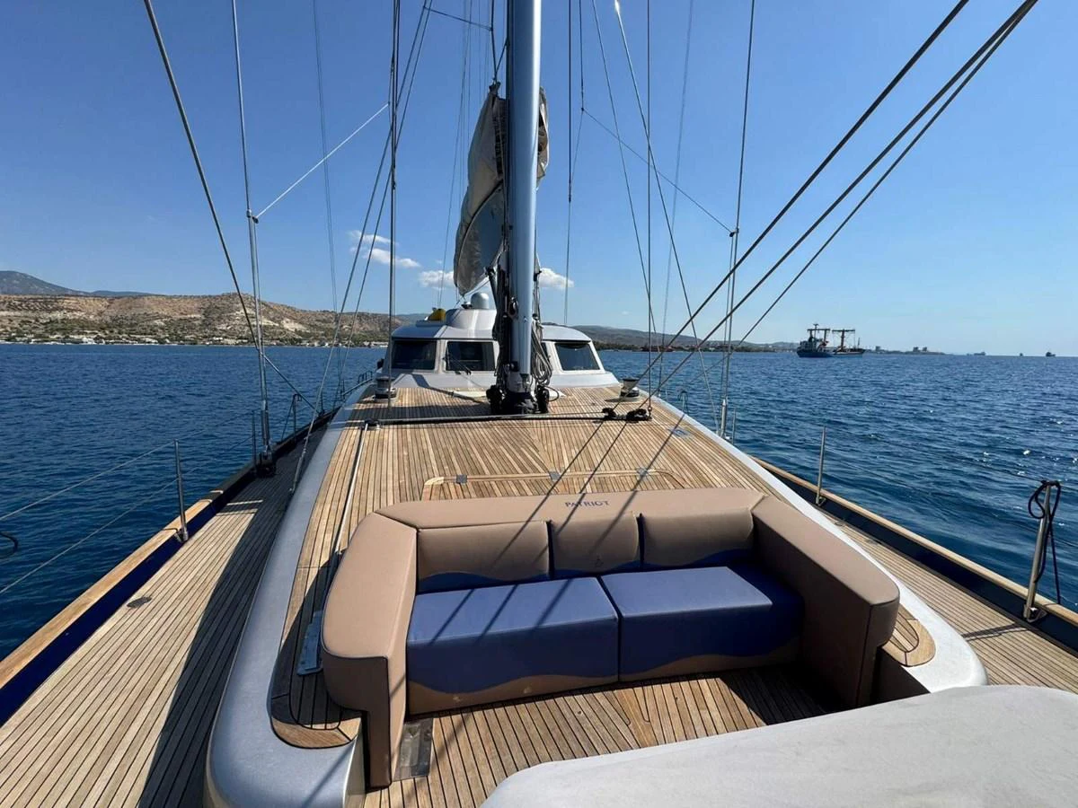 The foredeck of the yacht features a comfortable seating area with panoramic ocean views. aboard PATRIOT Yacht for Sale