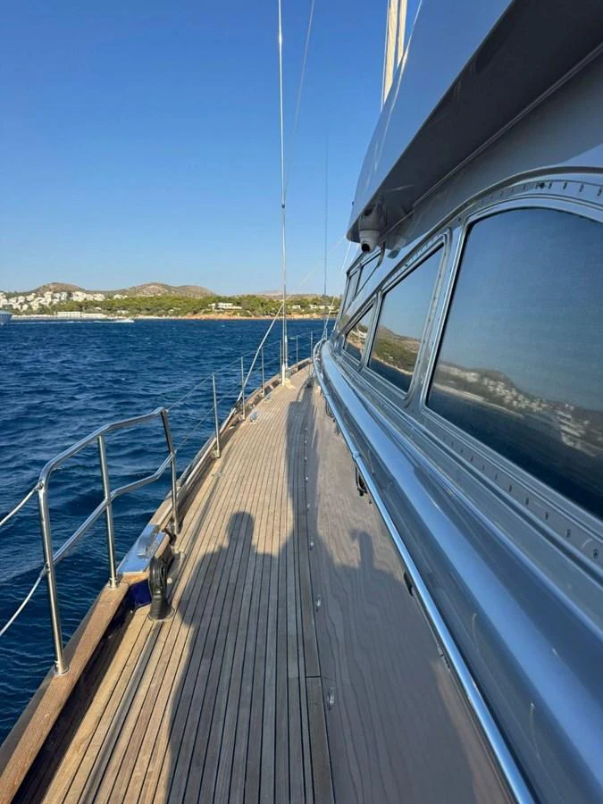 The yacht's deck offers a serene view of the surrounding waters and distant shoreline. aboard PATRIOT Yacht for Sale