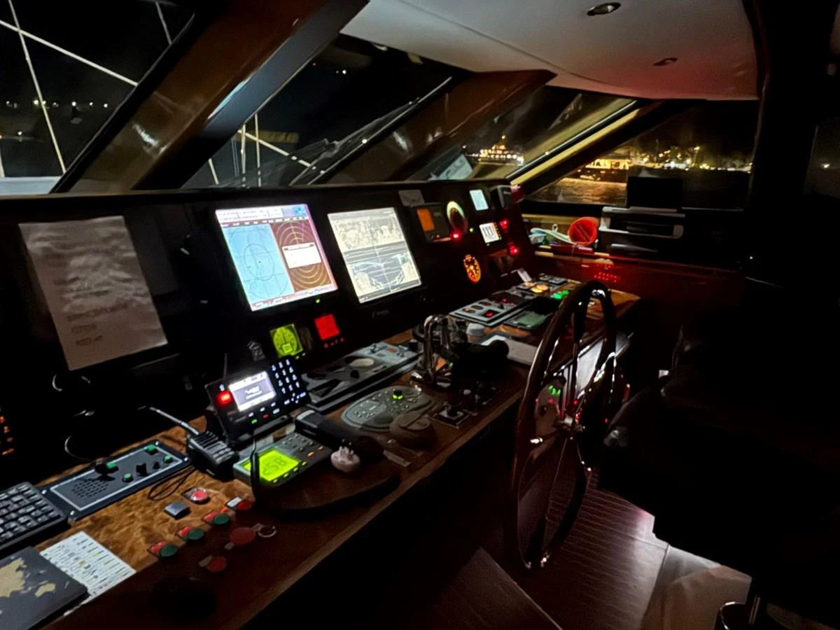 The helm station is equipped with advanced navigation and control systems, offering a sophisticated command center for the yacht. aboard PATRIOT Yacht for Sale