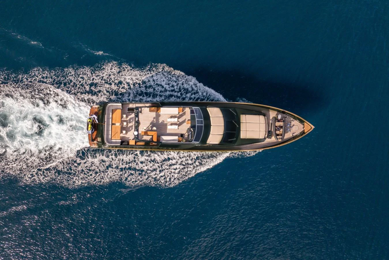 An aerial view of a sleek yacht cruising through deep blue waters. aboard CAN'T REMEMBER Yacht for Sale