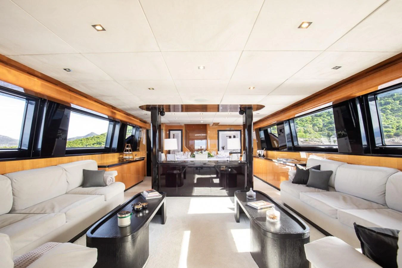 The spacious salon features plush seating and panoramic windows, creating a luxurious and inviting atmosphere. aboard CAN'T REMEMBER Yacht for Sale