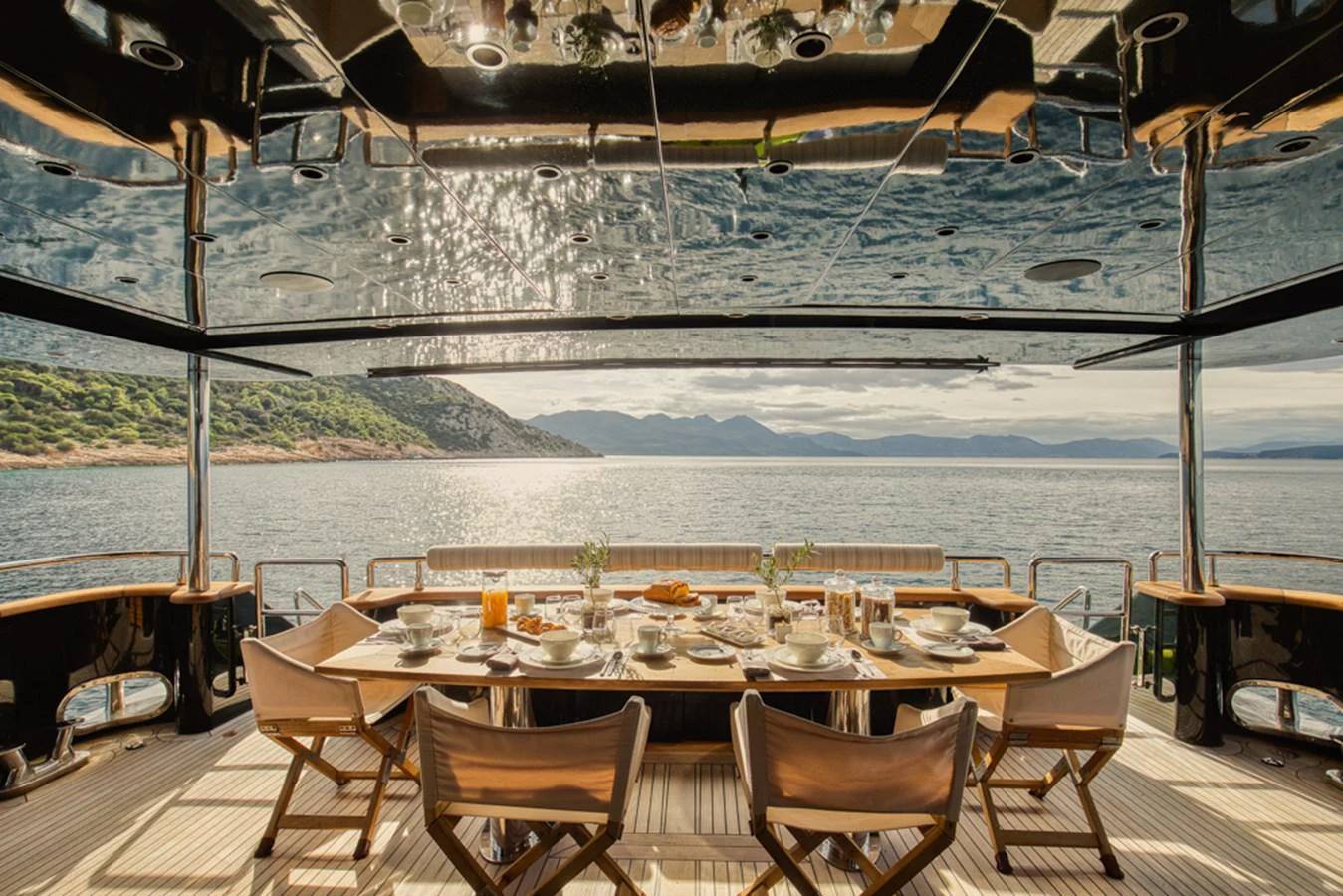 The aft deck features an elegant dining area with stunning views of the surrounding waters. aboard CAN'T REMEMBER Yacht for Sale
