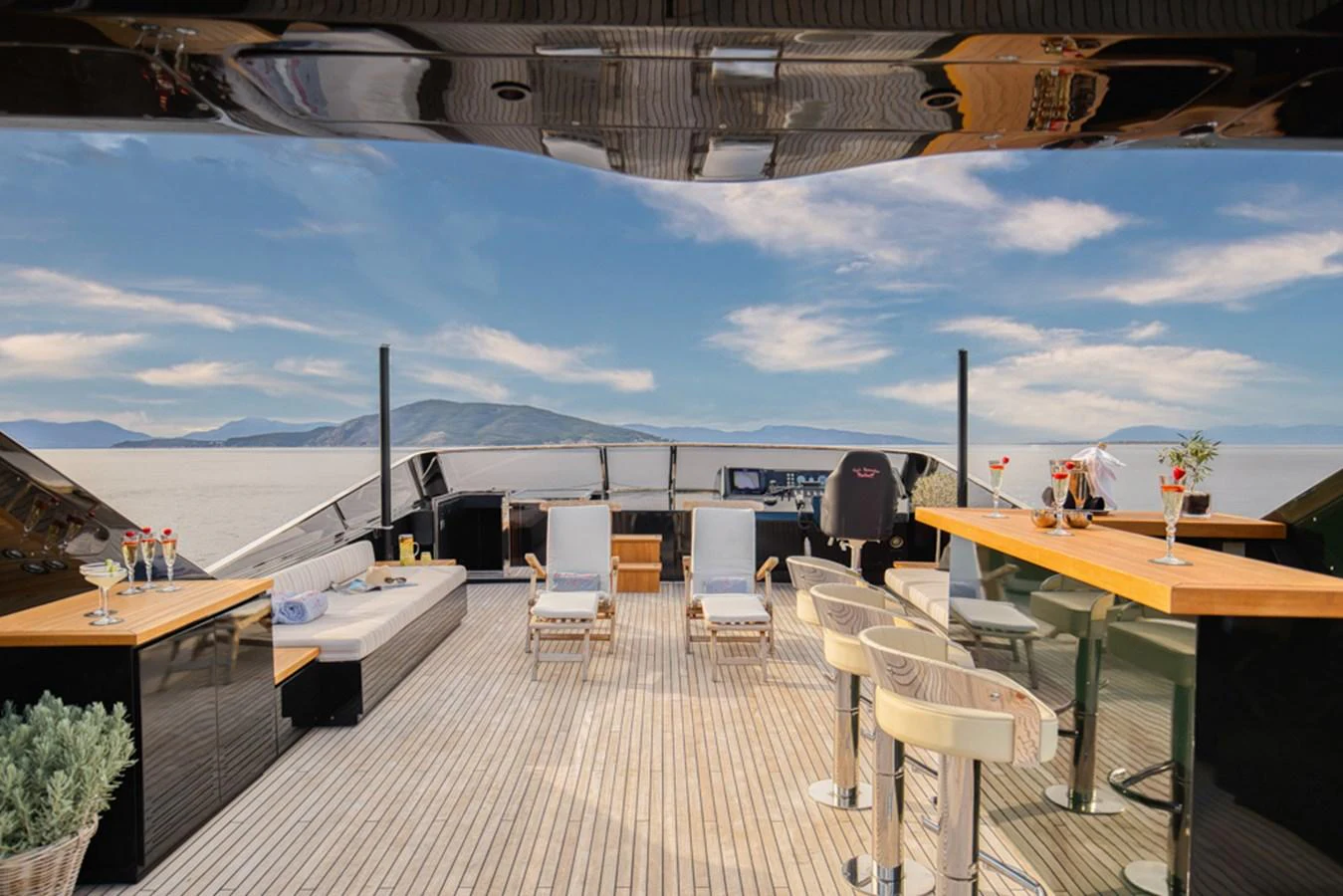 The sundeck offers a luxurious open-air space with comfortable seating and stunning ocean views. aboard CAN'T REMEMBER Yacht for Sale