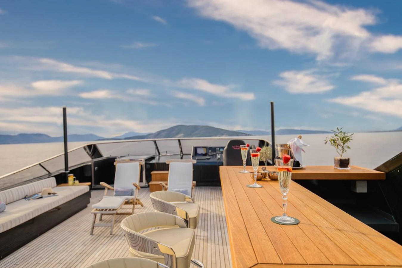 The flybridge offers a luxurious open-air space with comfortable seating and a bar, perfect for enjoying scenic views. aboard CAN'T REMEMBER Yacht for Sale
