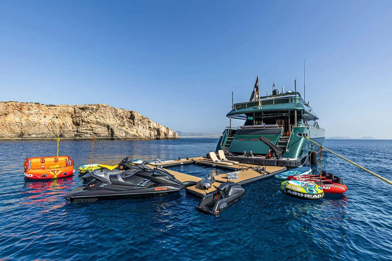 The yacht's aft deck is equipped with an array of water toys, including jet skis and inflatable tubes, perfect for adventurous water activities. aboard CAN'T REMEMBER Yacht for Sale