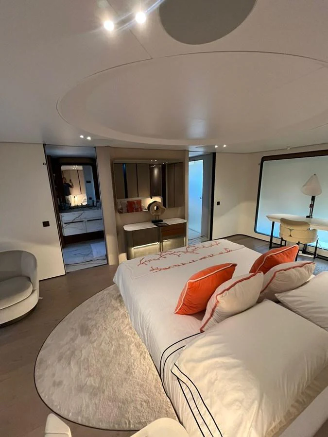 The master stateroom features a luxurious bed with elegant decor and ample natural light. aboard LUZ DE MAR Yacht for Sale