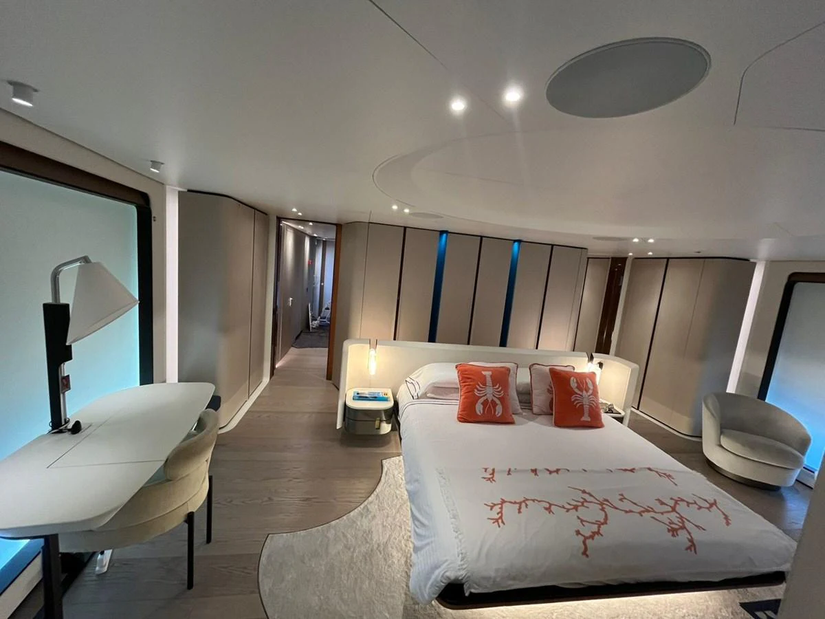 The master stateroom features a luxurious bed with elegant decor and modern furnishings. aboard LUZ DE MAR Yacht for Sale