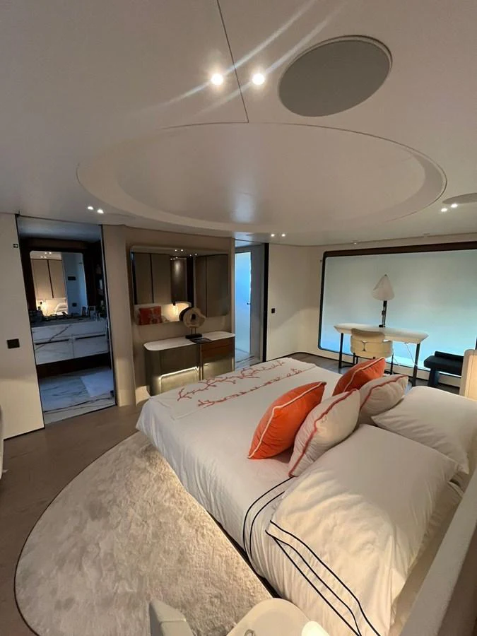 A luxurious stateroom featuring a plush bed with elegant linens and modern decor. aboard LUZ DE MAR Yacht for Sale