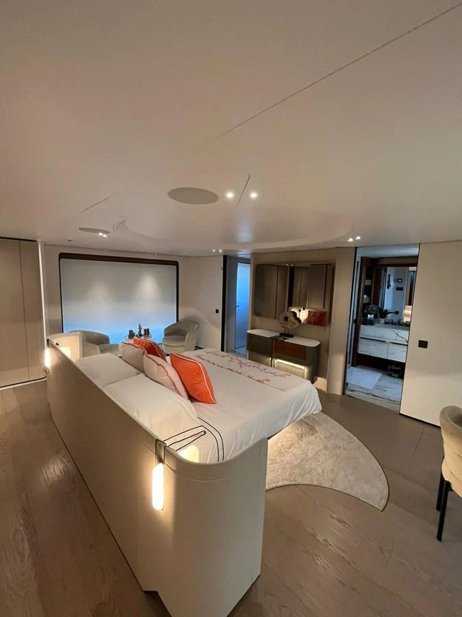 The master stateroom features a luxurious bed with elegant lighting and modern furnishings. aboard LUZ DE MAR Yacht for Sale