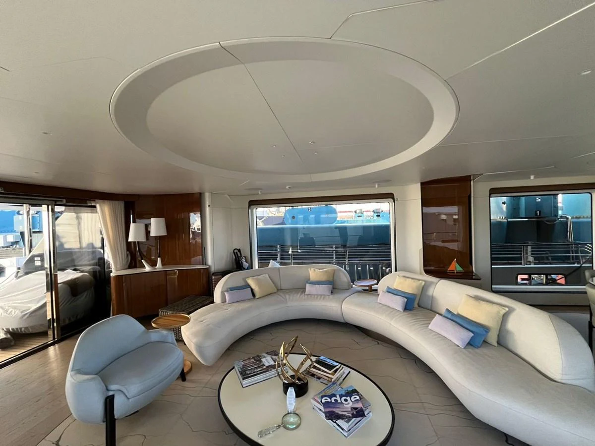 The salon features a spacious and elegant seating area with modern furnishings and large windows offering ample natural light. aboard LUZ DE MAR Yacht for Sale