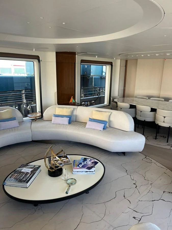 The yacht's salon features a modern, elegant design with comfortable seating and stylish decor. aboard LUZ DE MAR Yacht for Sale