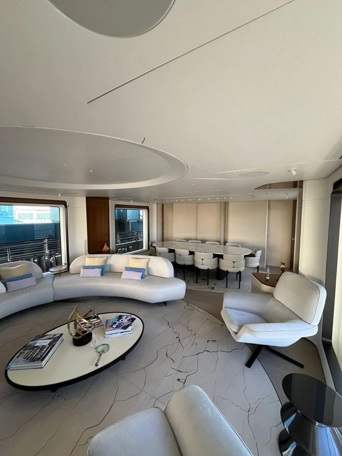 The spacious salon features elegant seating and a modern design, perfect for relaxation and socializing. aboard LUZ DE MAR Yacht for Sale