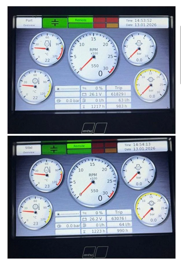 The yacht's helm displays detailed engine performance metrics on dual screens. aboard LUZ DE MAR Yacht for Sale