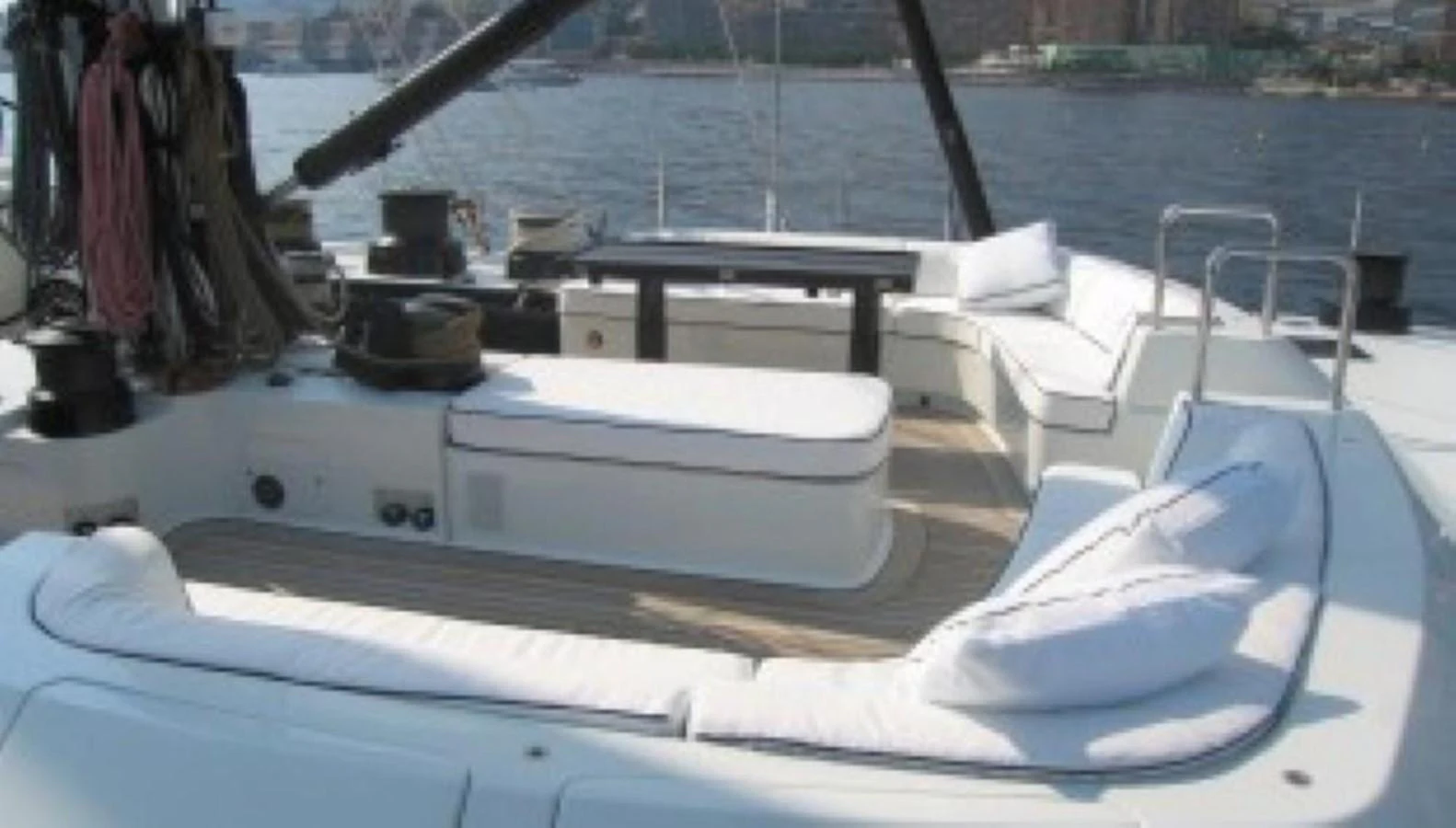 The yacht's aft deck features comfortable seating with a scenic view of the water. aboard MARI-CHA III Yacht for Sale