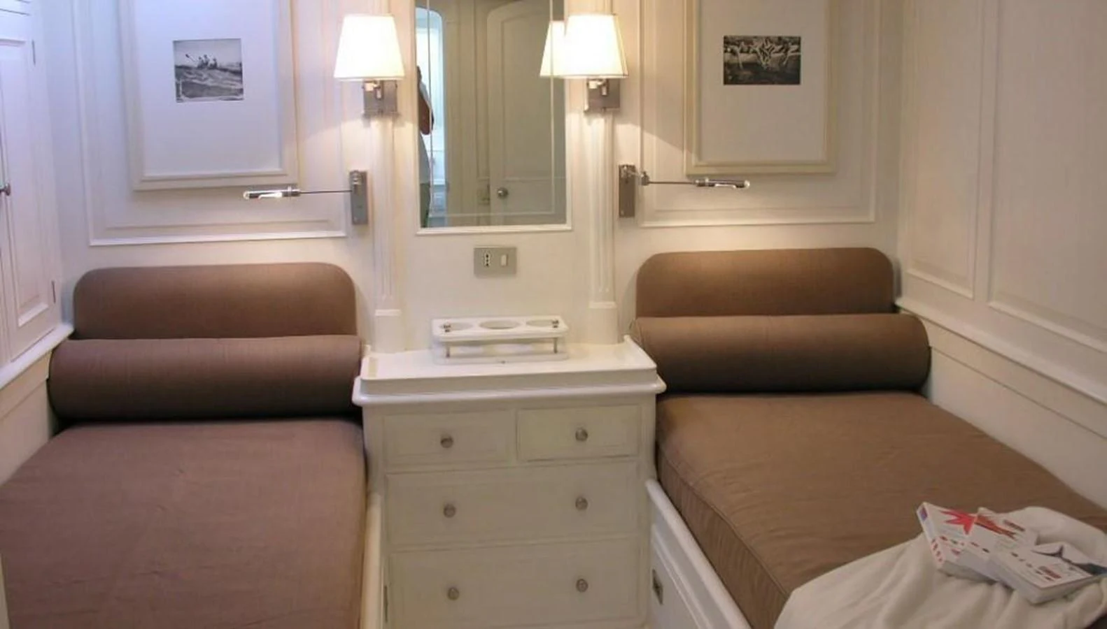 The guest stateroom features twin beds with a classic and cozy design. aboard MARI-CHA III Yacht for Sale