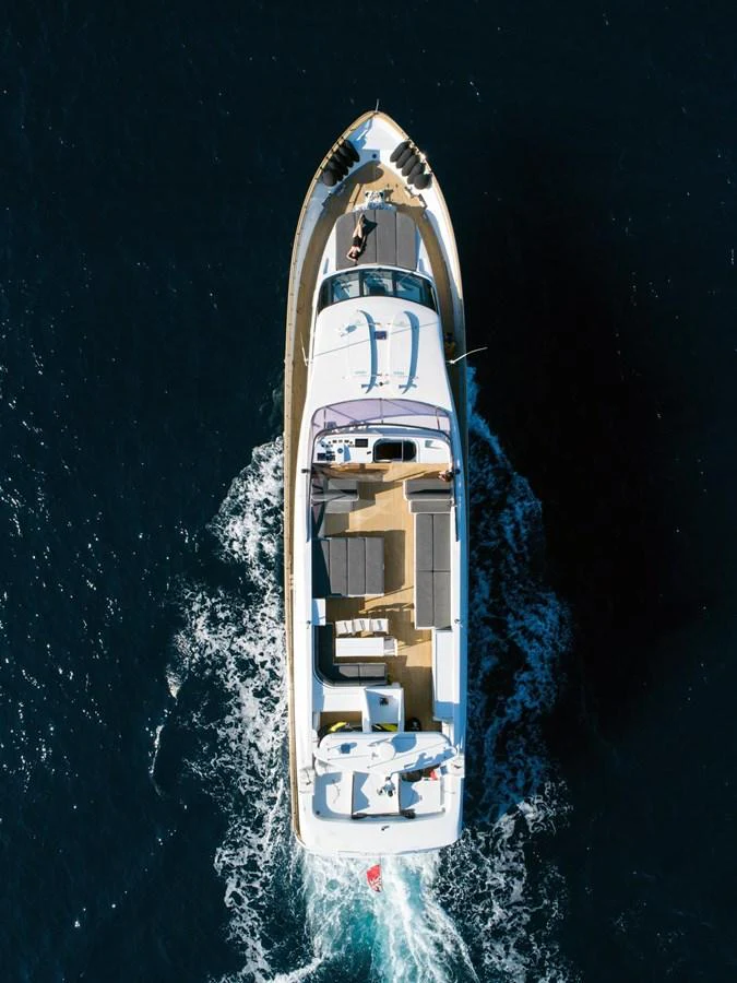 Aerial view of a sleek yacht cruising through deep blue waters. aboard TALILA Yacht for Sale