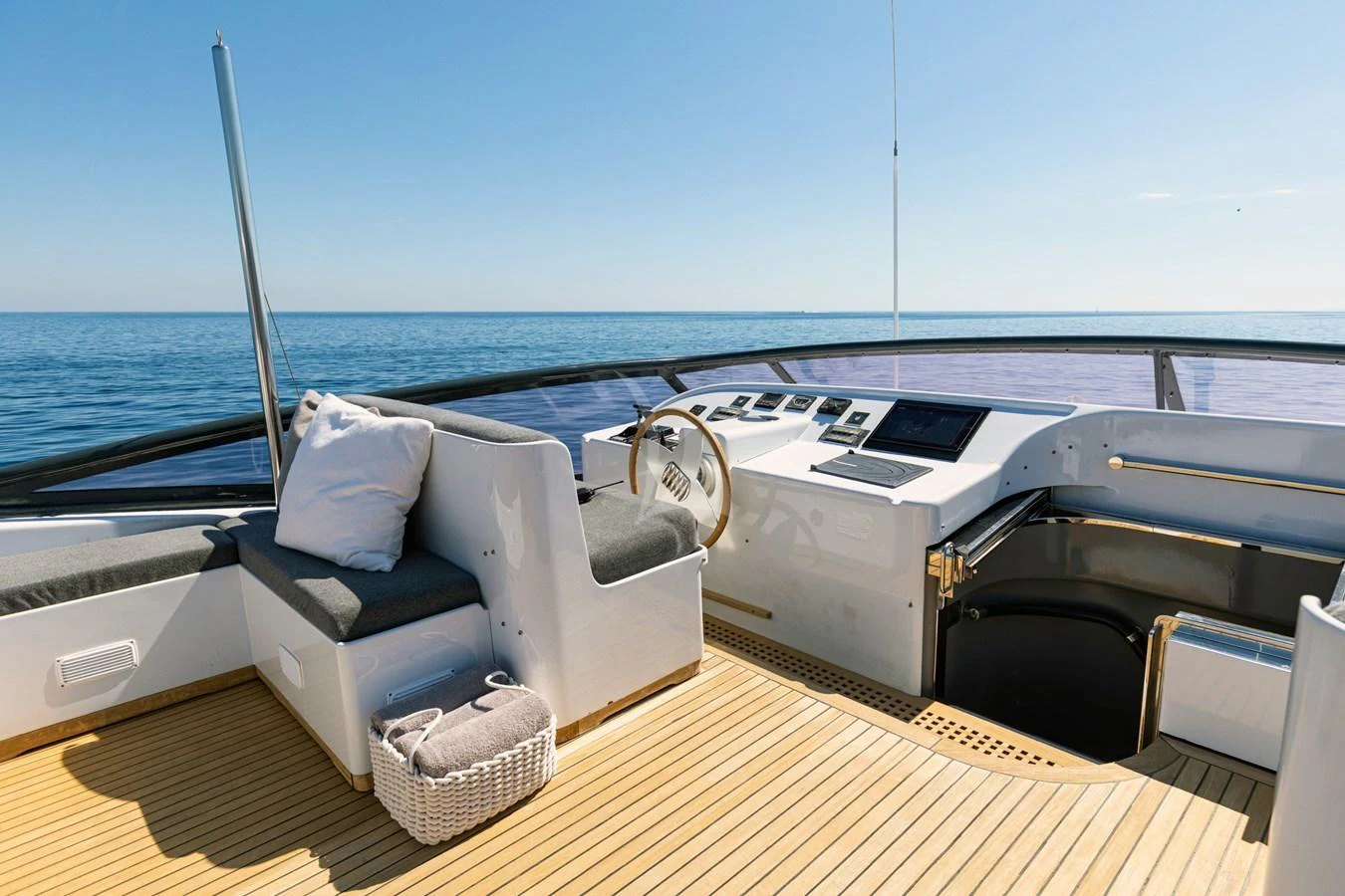 The helm station offers a sleek and modern design with panoramic ocean views. aboard TALILA Yacht for Sale