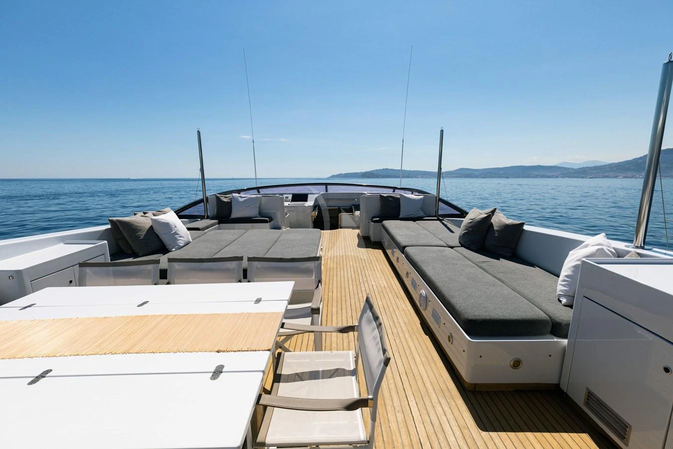 The spacious aft deck offers luxurious lounging and dining areas with stunning ocean views. aboard TALILA Yacht for Sale