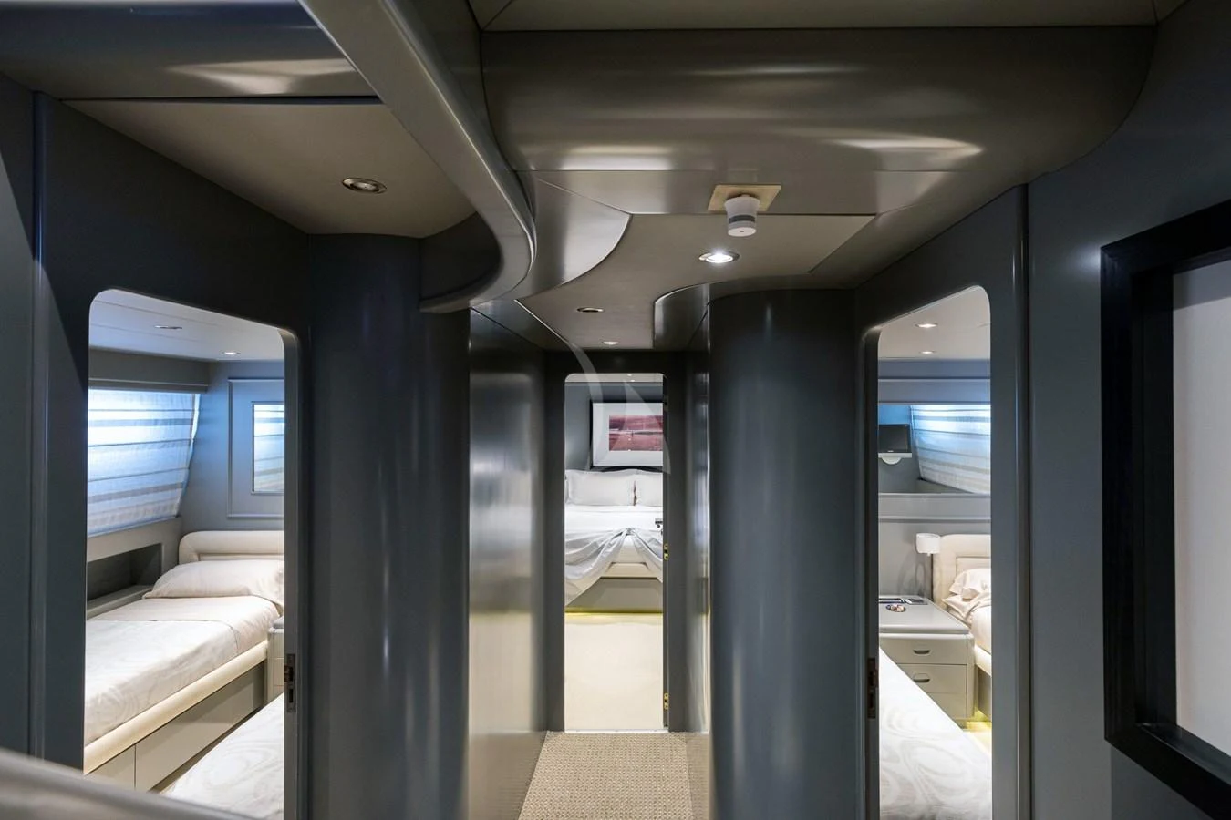 A sleek and modern hallway leads to luxurious staterooms on this yacht. aboard TALILA Yacht for Sale