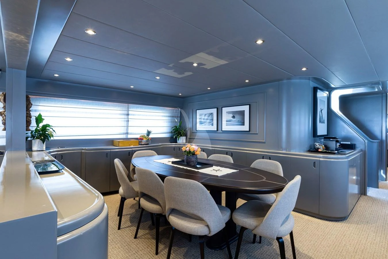 The yacht's dining area features a sleek, modern design with ample seating and elegant decor. aboard TALILA Yacht for Sale