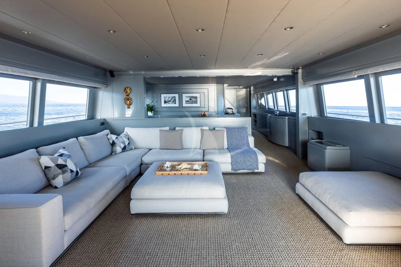 The spacious salon features comfortable seating with panoramic ocean views. aboard TALILA Yacht for Sale