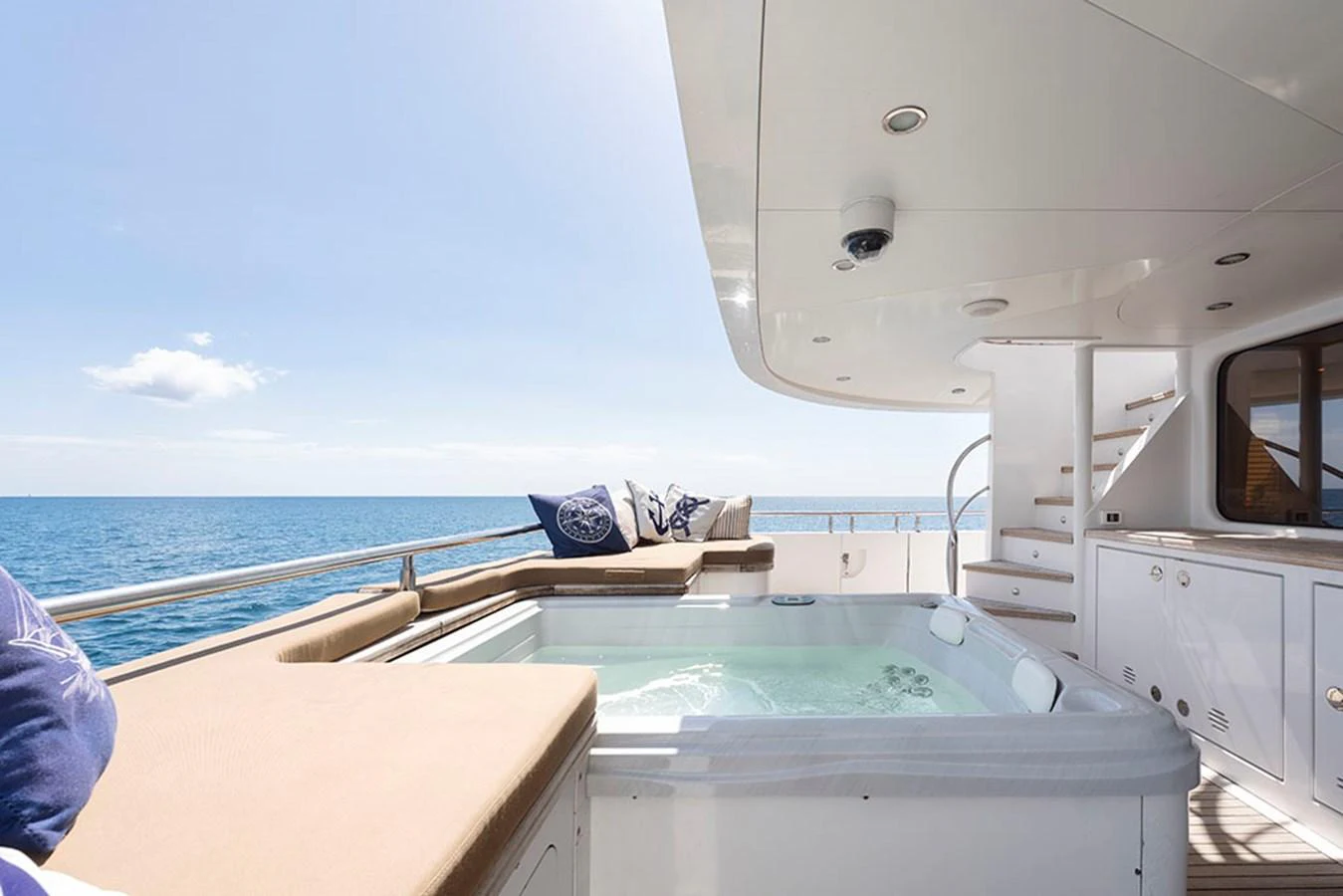 The aft deck features a luxurious jacuzzi with stunning ocean views. aboard BANDIDO Yacht for Sale